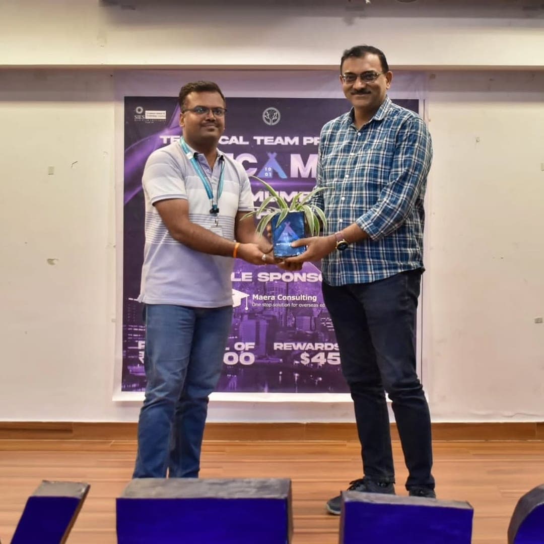 A planter handed to a guest on stage at the hackathon.